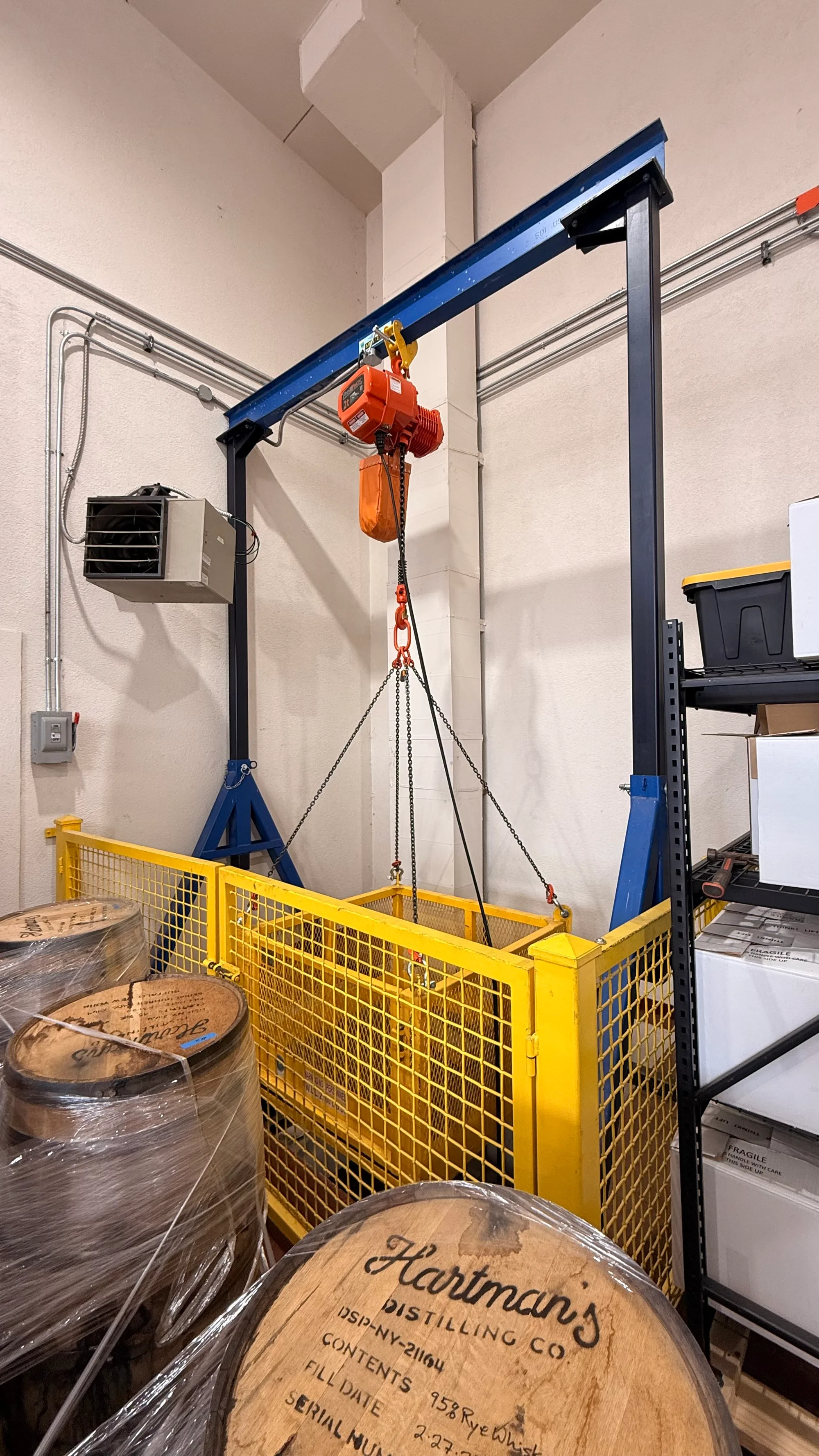 Gantry crane with electric chain hoist, safety barrier